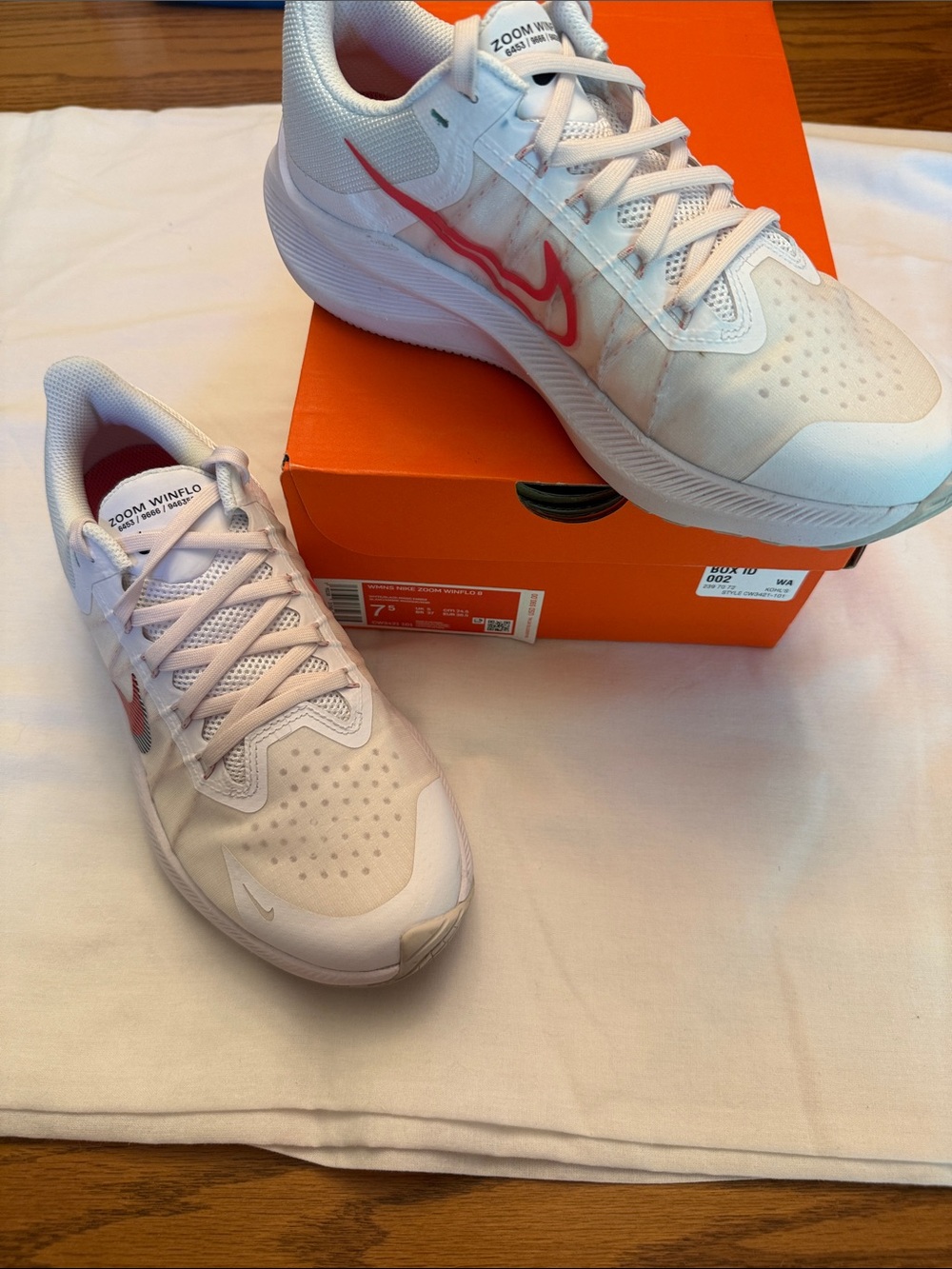 Nike Women's White Athletic Shoes with Pink Swoosh